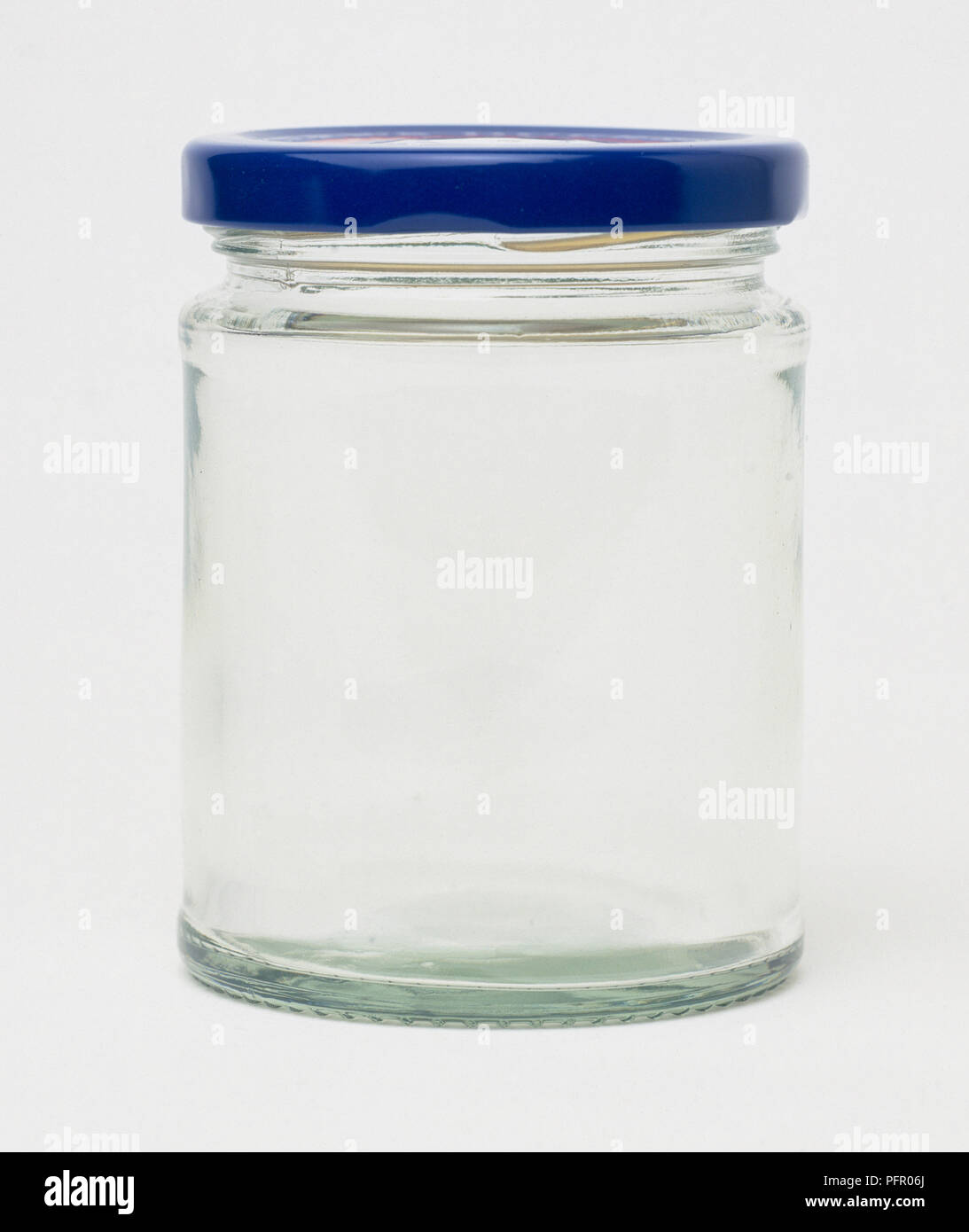 Empty glass jar with blue lid Stock Photo Alamy