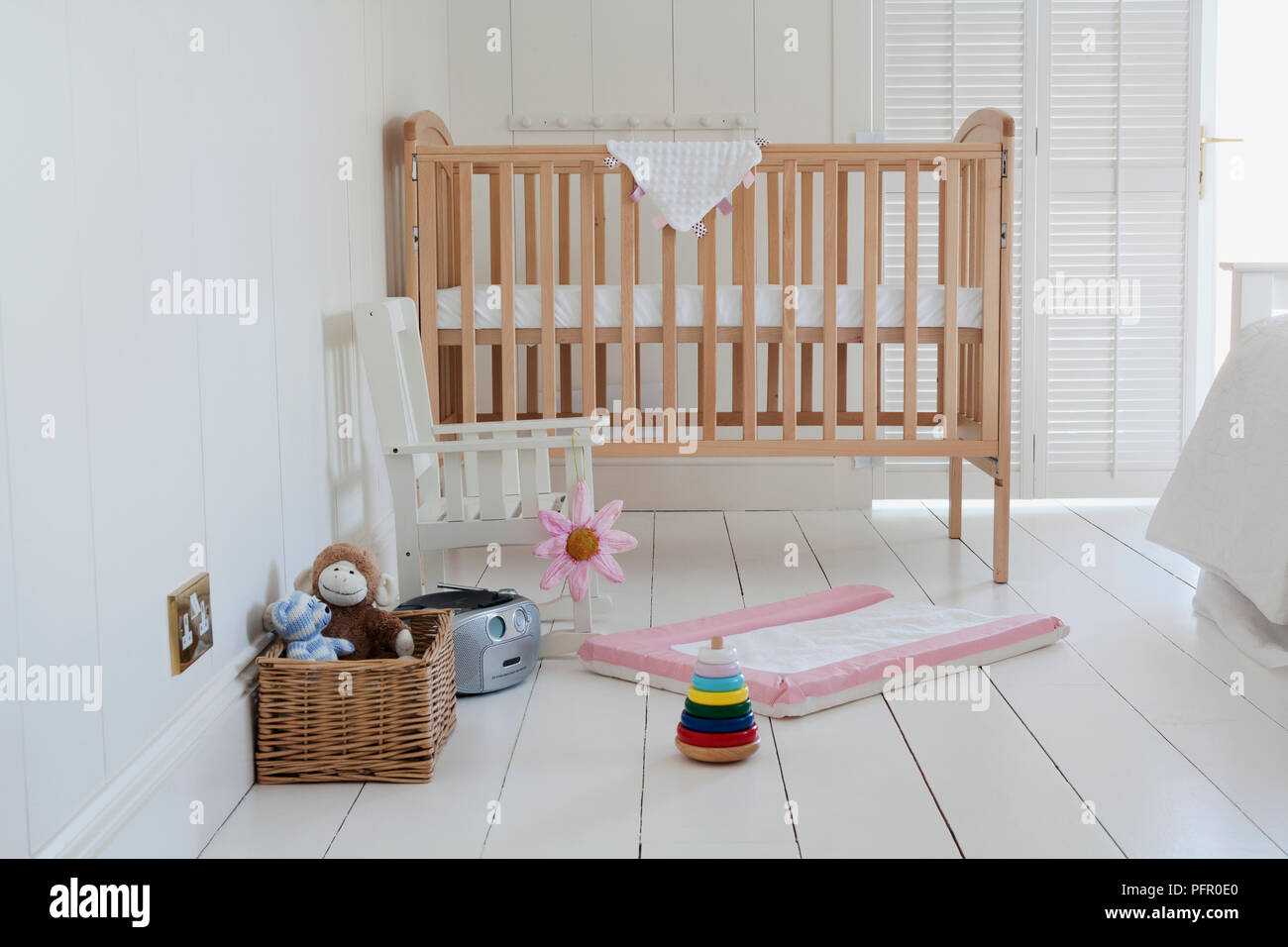 white and wood cot bed