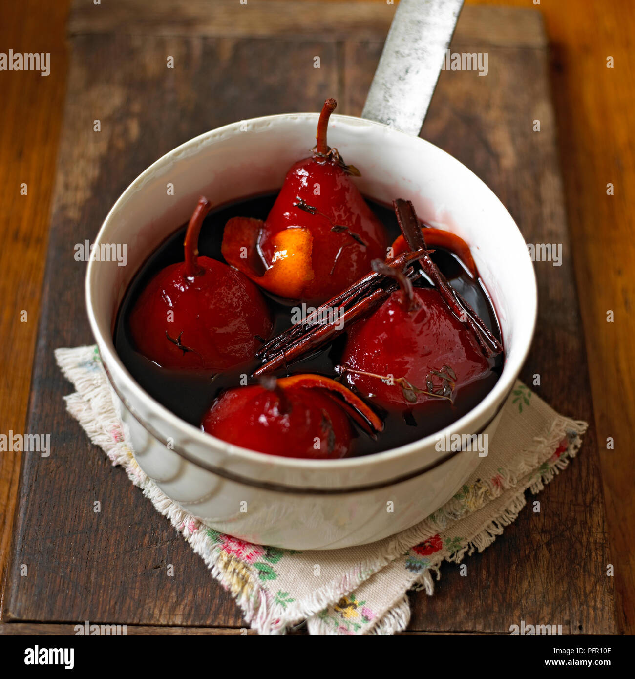 Pears poached in red wine Stock Photo