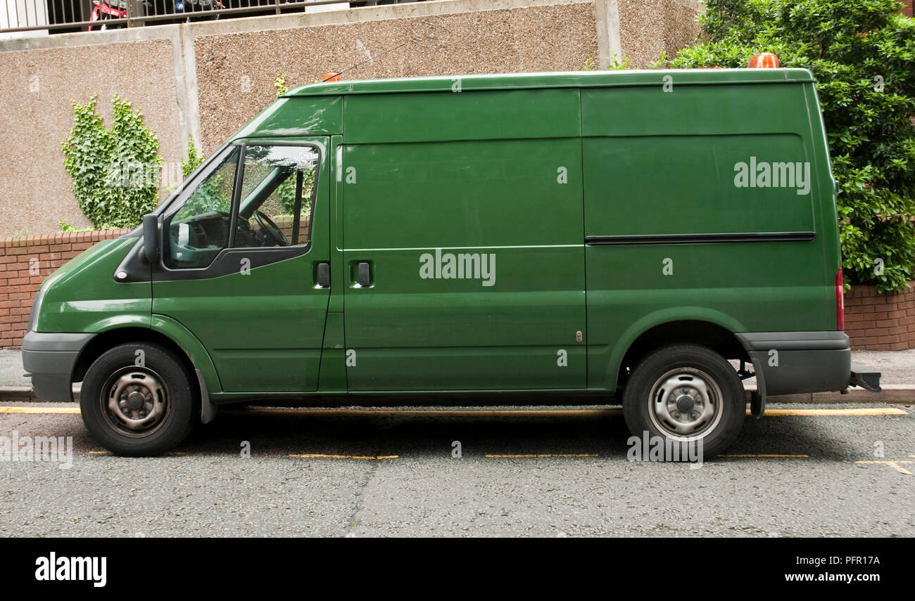 Great Britain, England, green van parked in the street Stock Photo