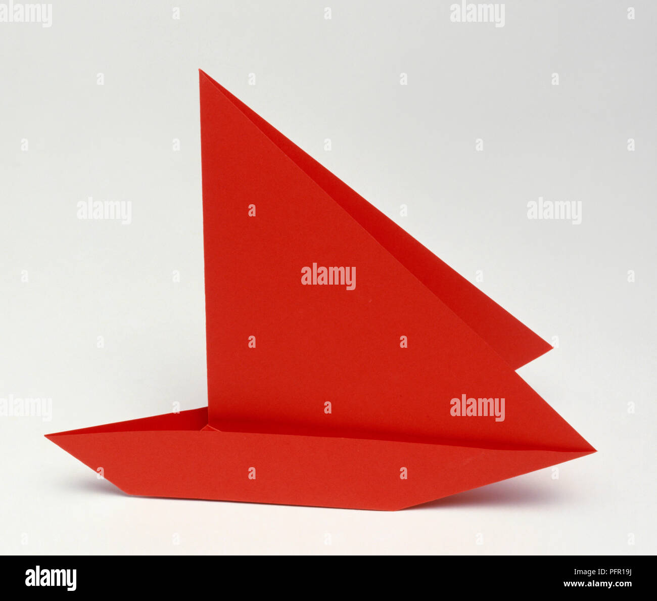 Red paper boat Stock Photo