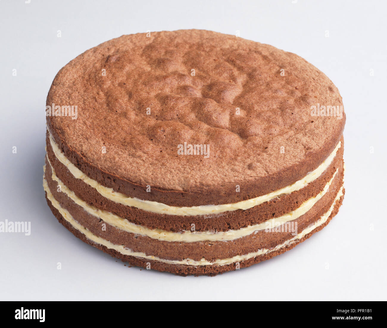 Baked sponge cake with buttercream layers, closeup Stock Photo Alamy