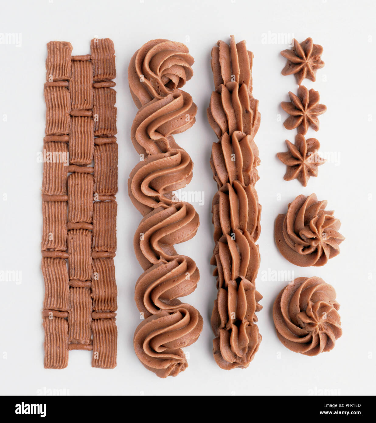 Piped chocolate icing designs, closeup Stock Photo Alamy