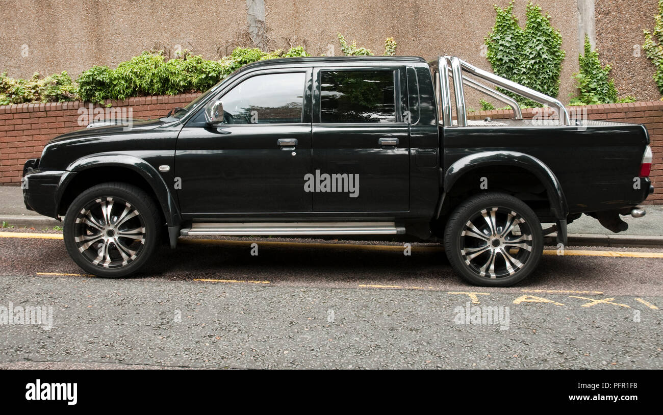 Great Britain, England, black pick-up truck parked in the street Stock Photo