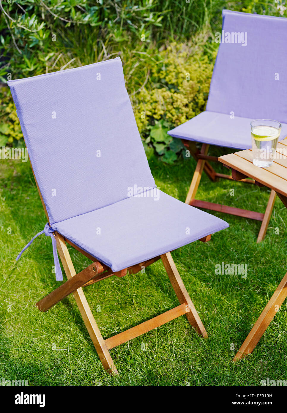 Pale Purple Canvas Seat Covers On Wooden Garden Chairs Next To