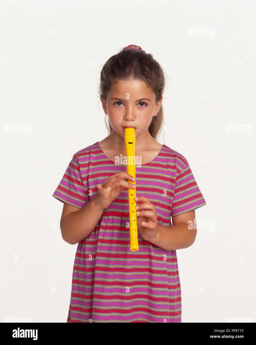 Girl playing a recorder, front view Stock Photo Alamy