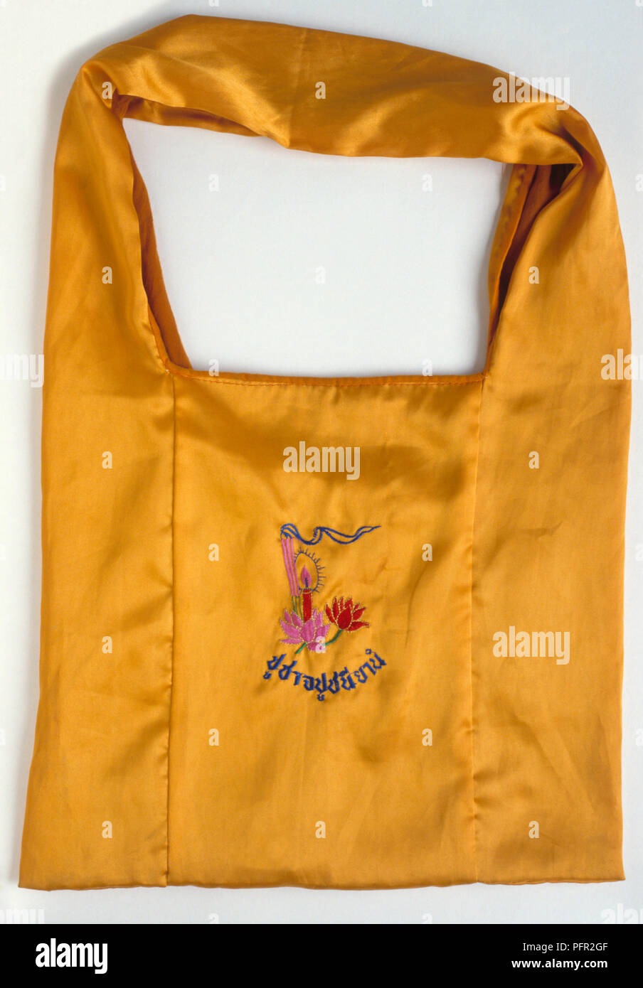 Orange silk Buddhist satchel Stock Photo