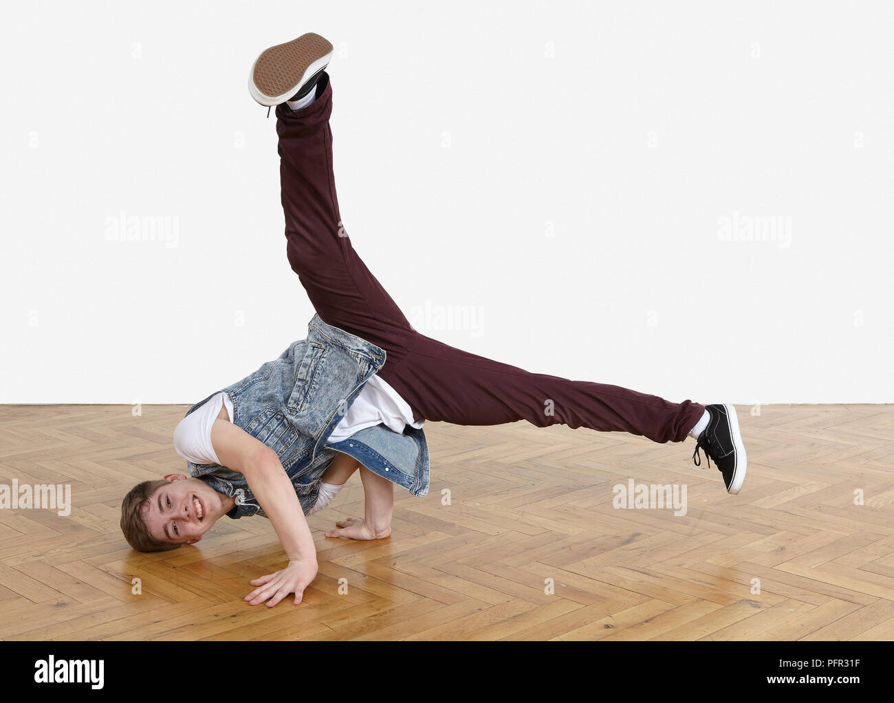Teenager performing breakdance moves Stock Photo - Alamy