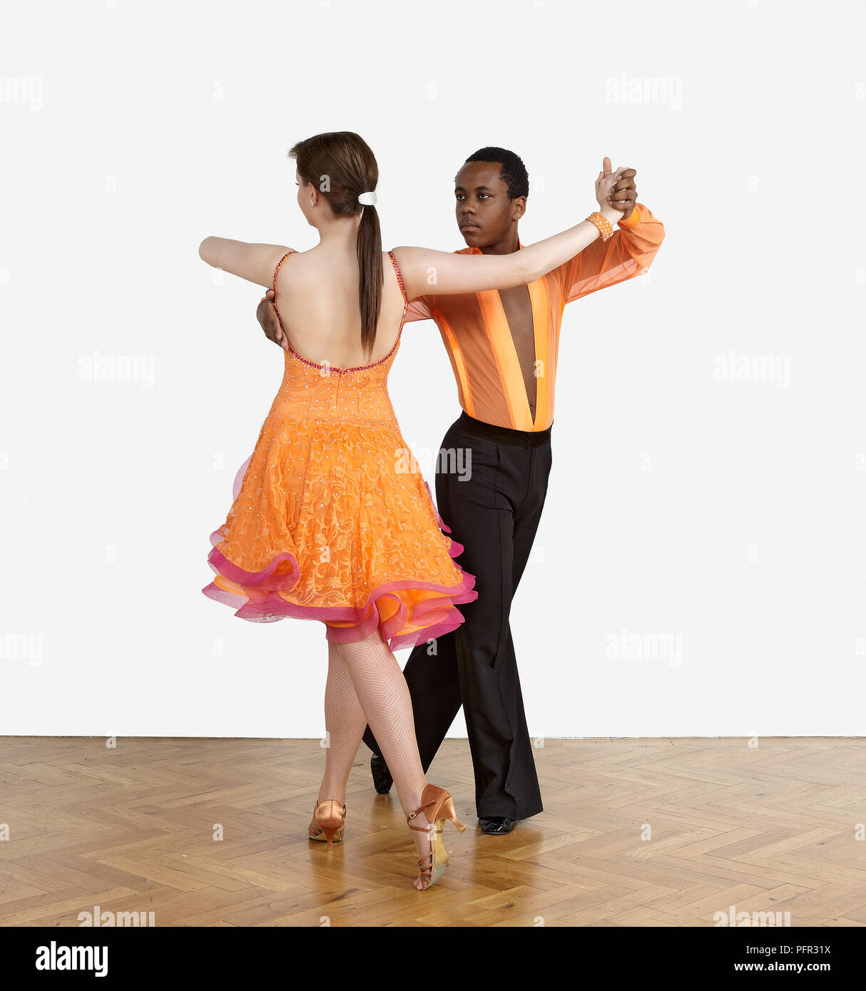 Teenage boy and girl dancing the rumba Stock Photo Alamy