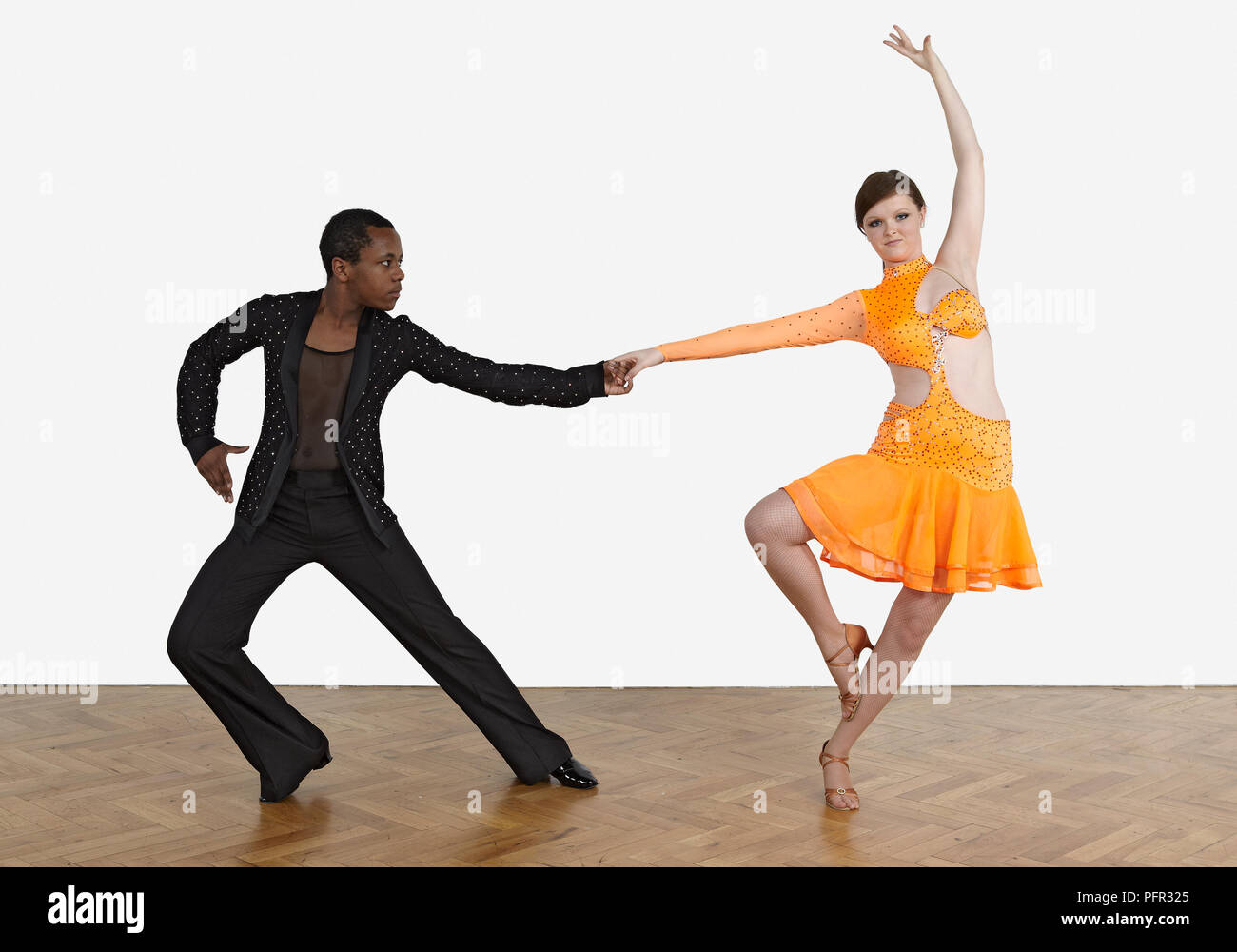 Teenage boy and girl dancing the rumba Stock Photo - Alamy