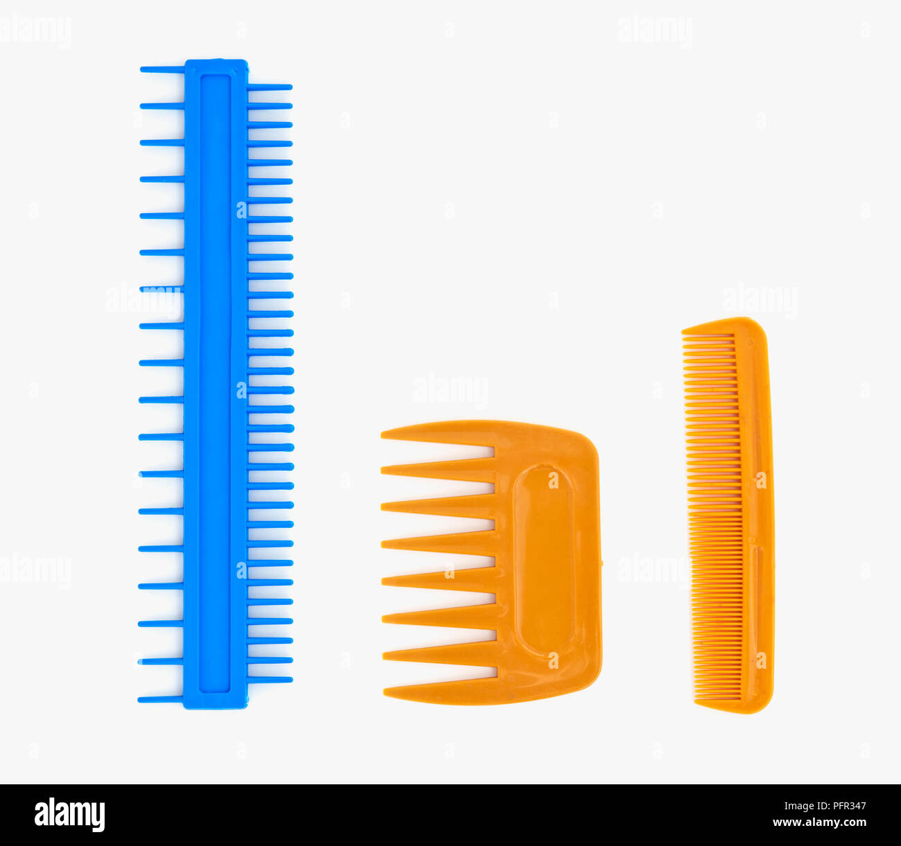 Three plastic combs, marbling comb, wide-toothed comb, and narrow-toothed comb Stock Photo