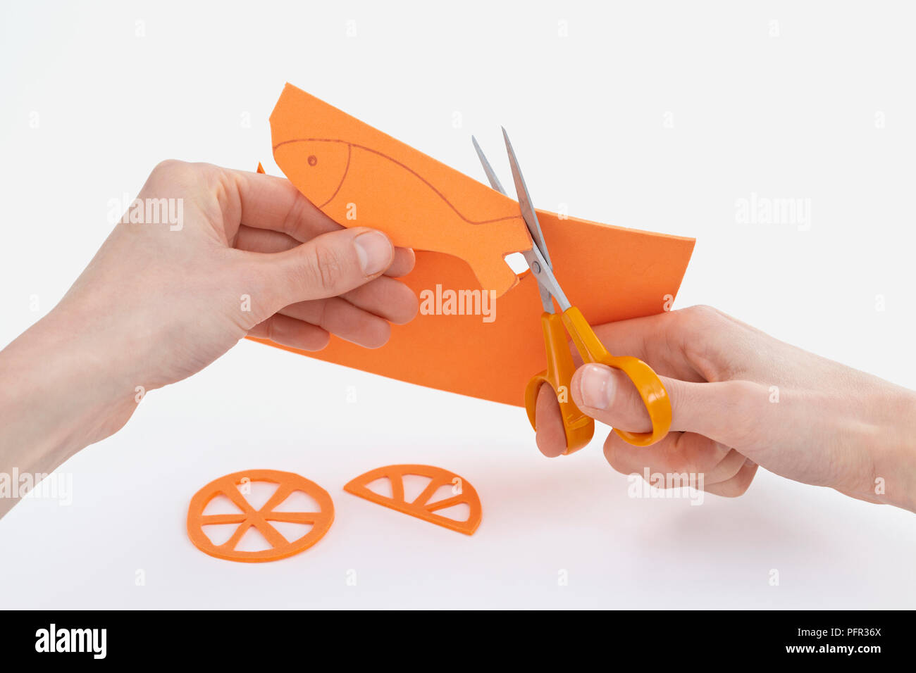 Scissors, paper bat, eyes and mouth on orange background, space for text  Stock Photo by AtlasComposer