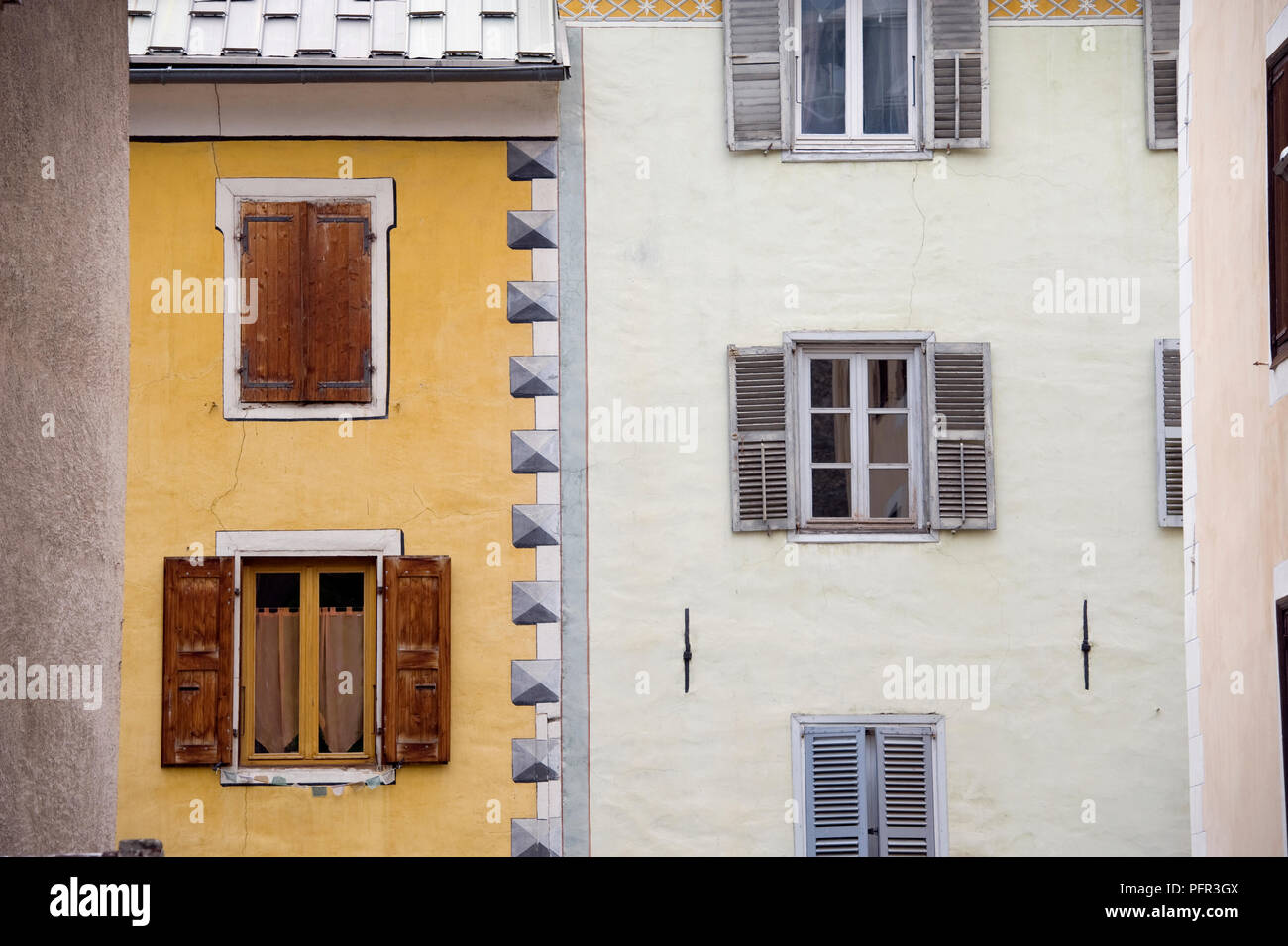 France, Cite Vauban, Place D'armes, facade of buildings with opens and closed shutters, close-up Stock Photo