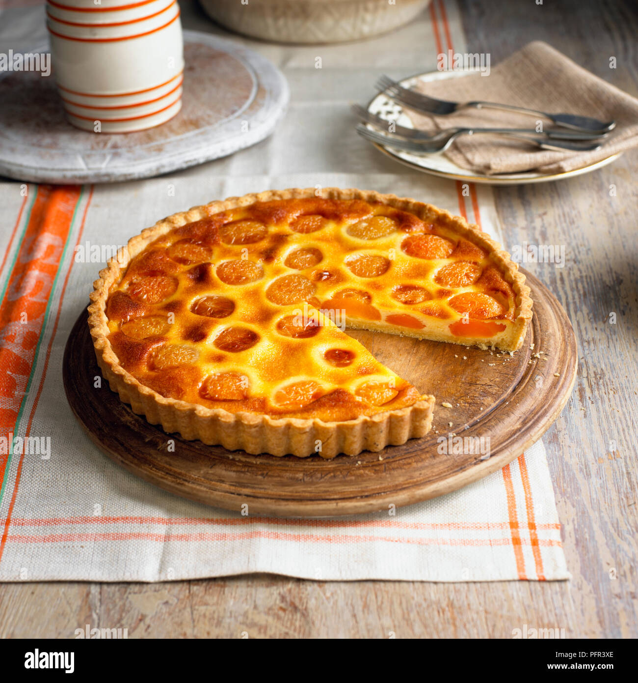 Apricot tart with slice missing Stock Photo