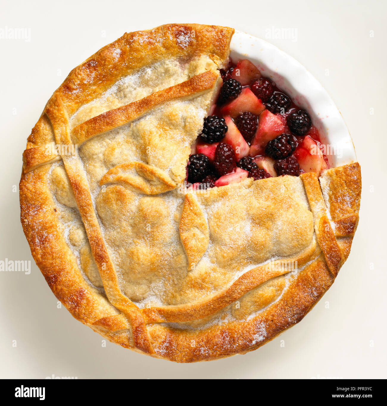 Blackberry and apple pie with part of crust removed, showing filling Stock Photo