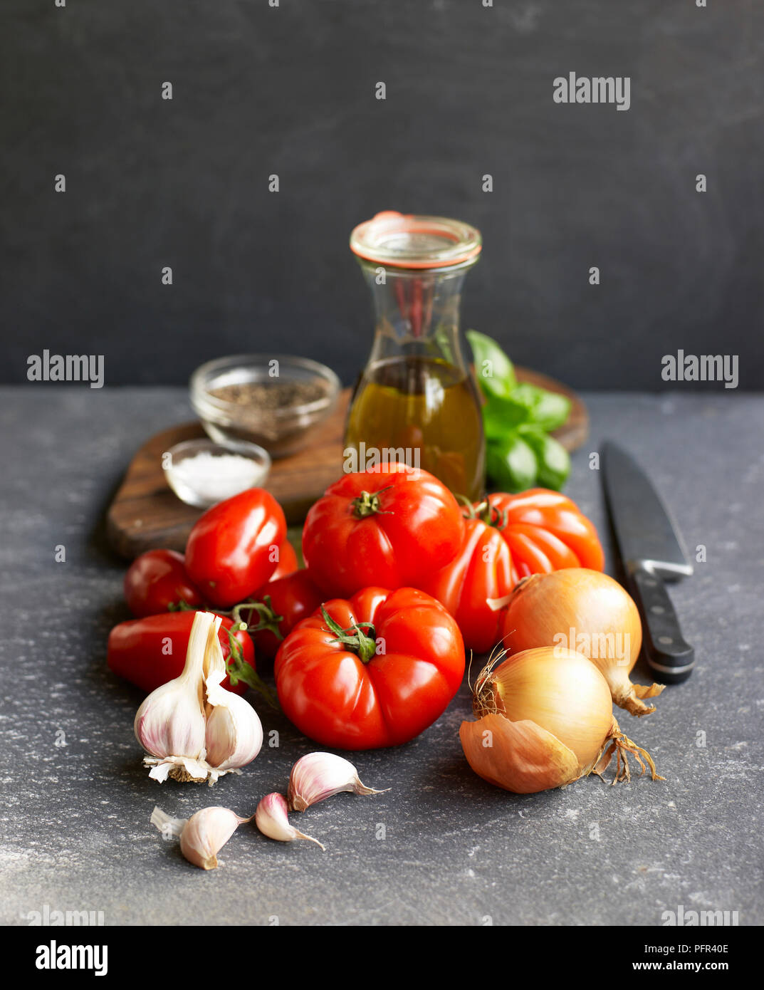 Fresh raw ingredients for making tomato sauce Stock Photo