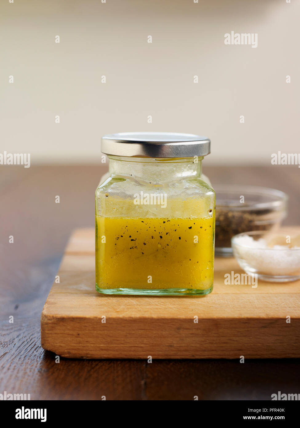 Jar of home-made vinaigrette sauce Stock Photo