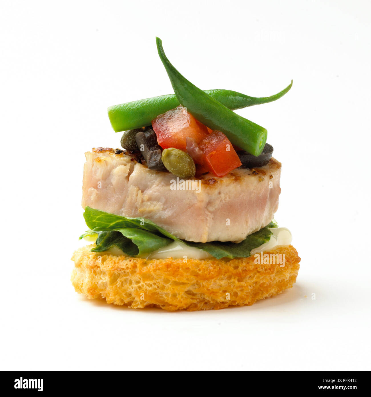Canape, seared tuna nicoise croute Stock Photo