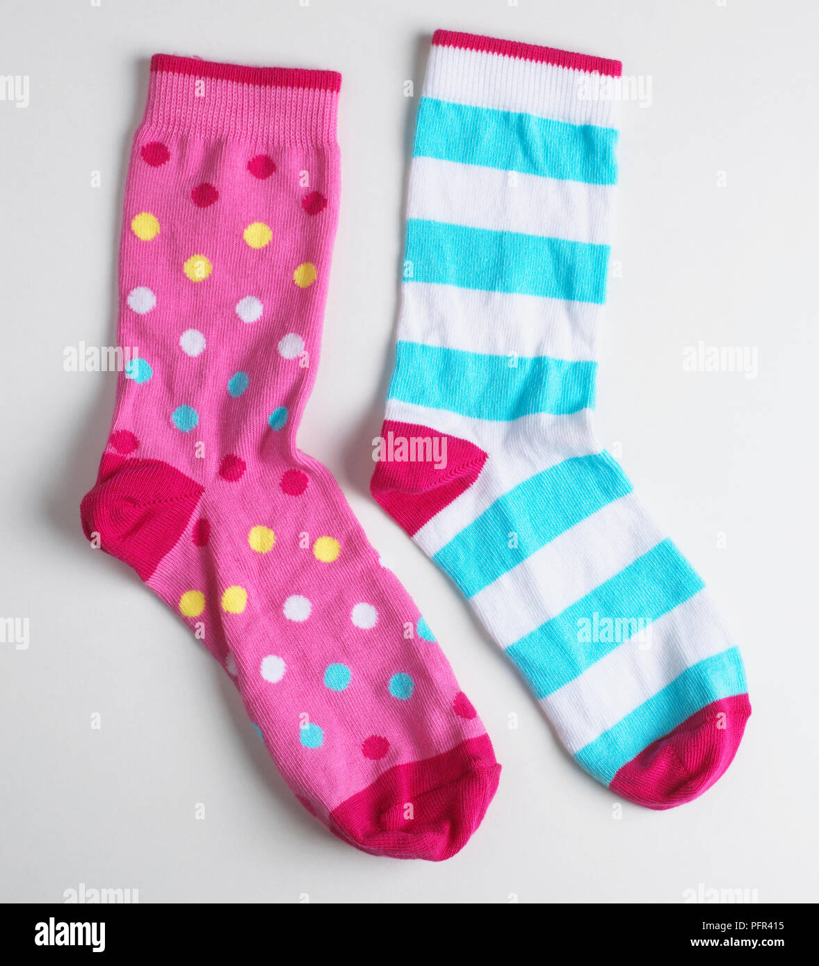 Colourful spotted and stripy socks Stock Photo