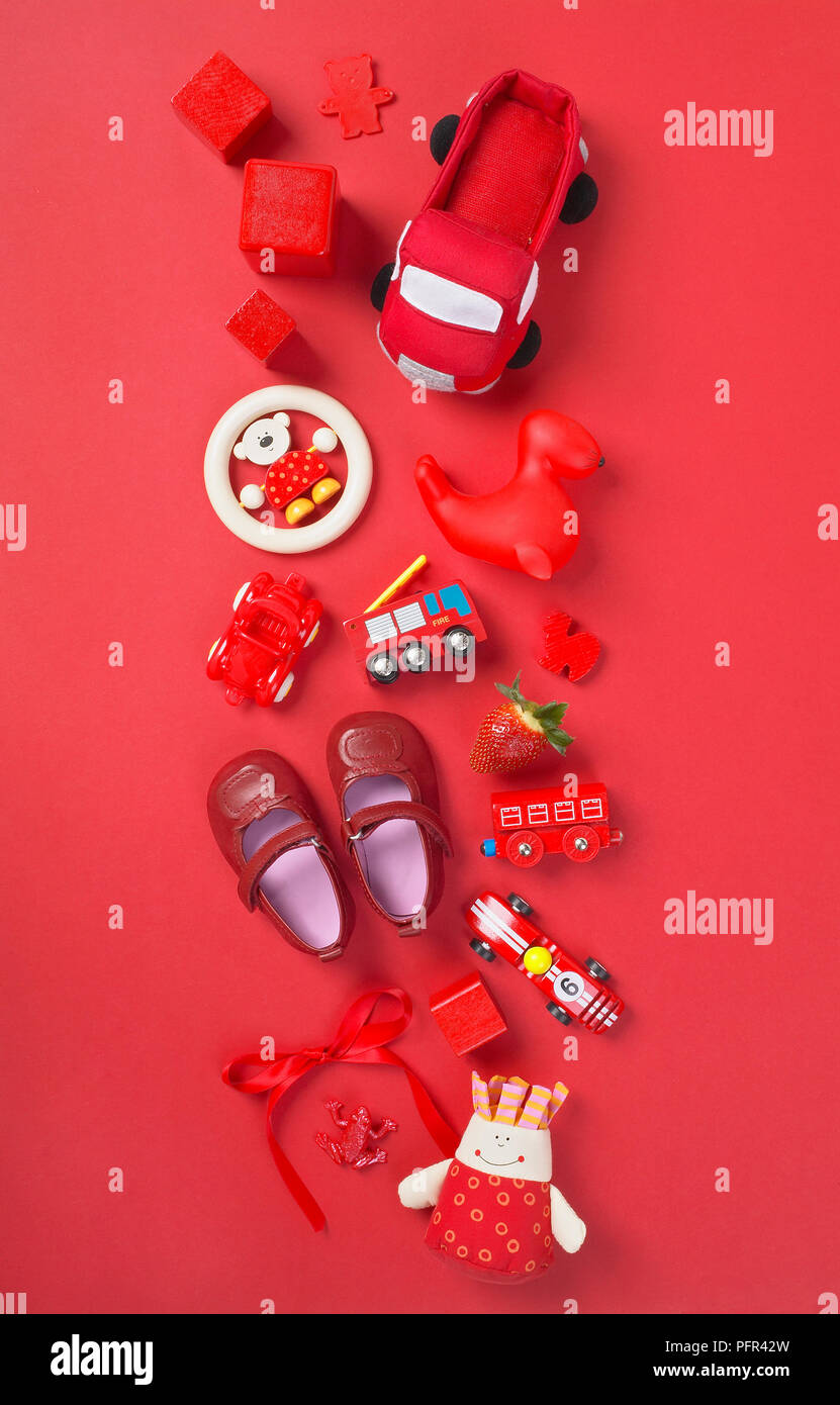 Selection of red toys on red background Stock Photo