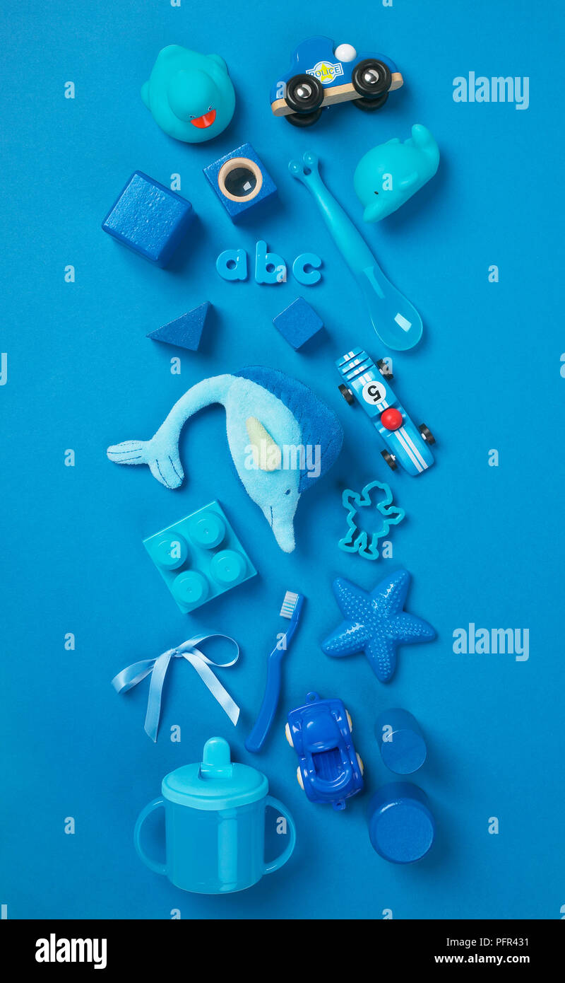 Selection of blue toys on blue background Stock Photo