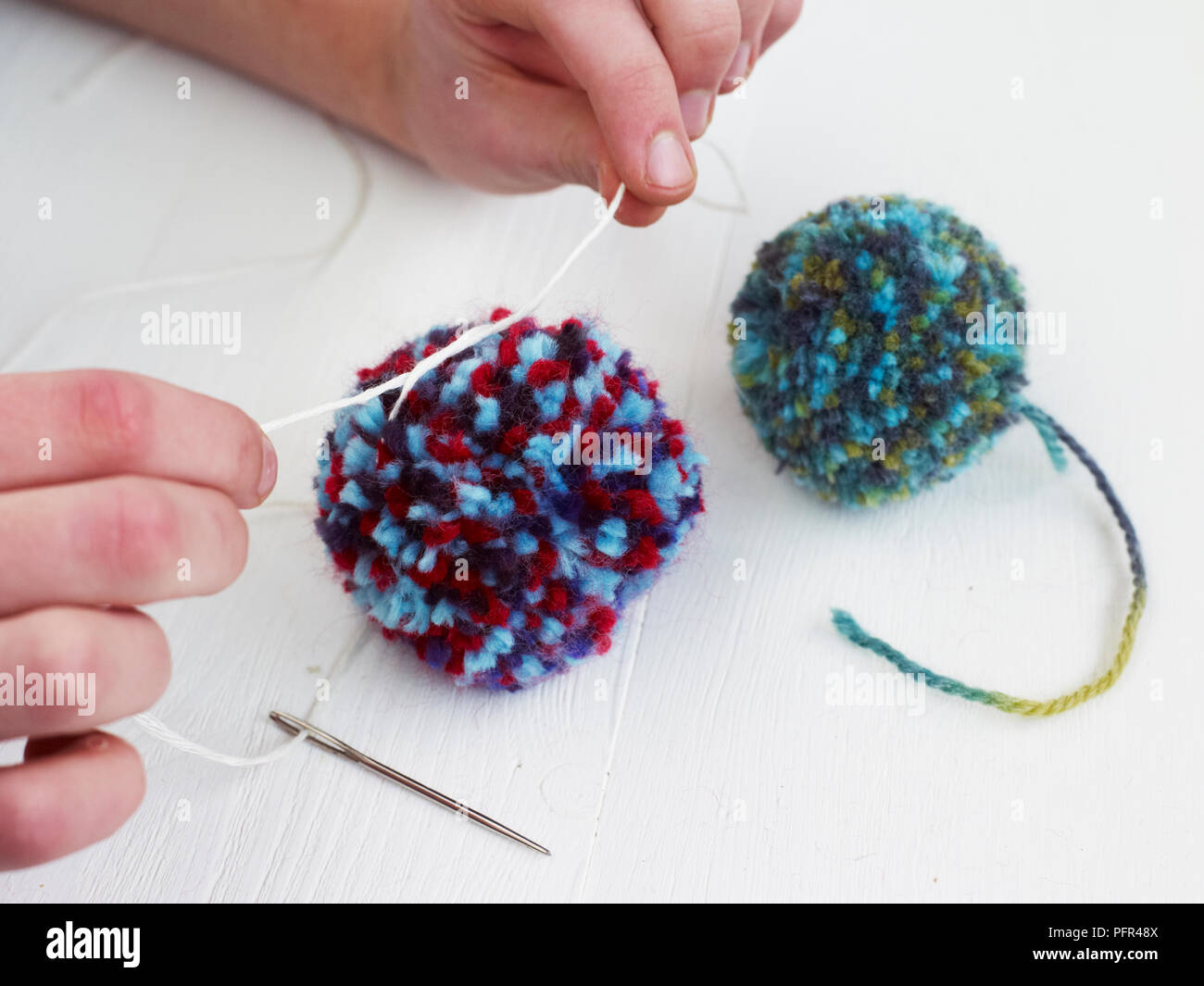 Making pom-poms Stock Photo