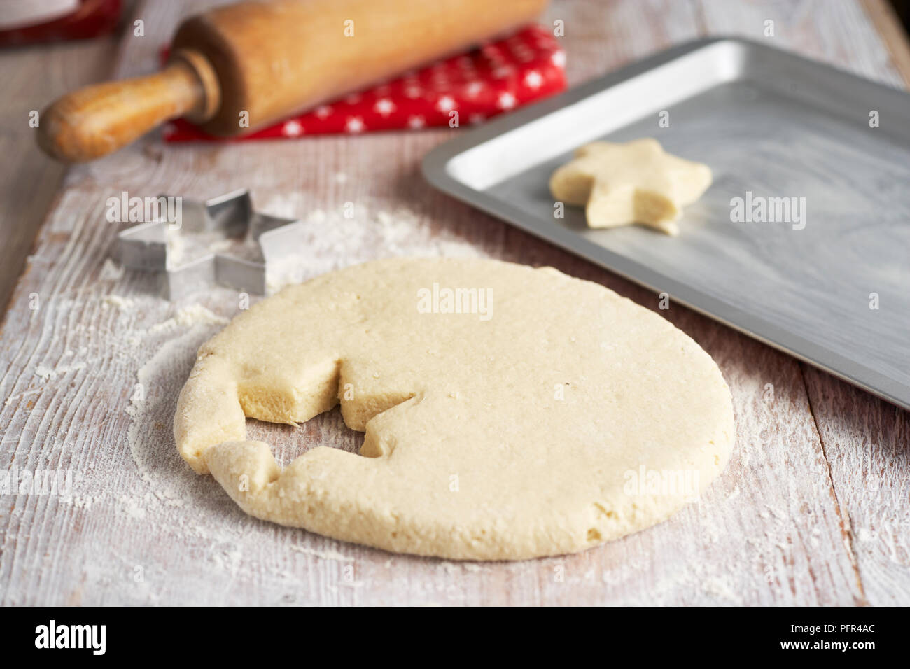 Star shape scone cut from dough Stock Photo