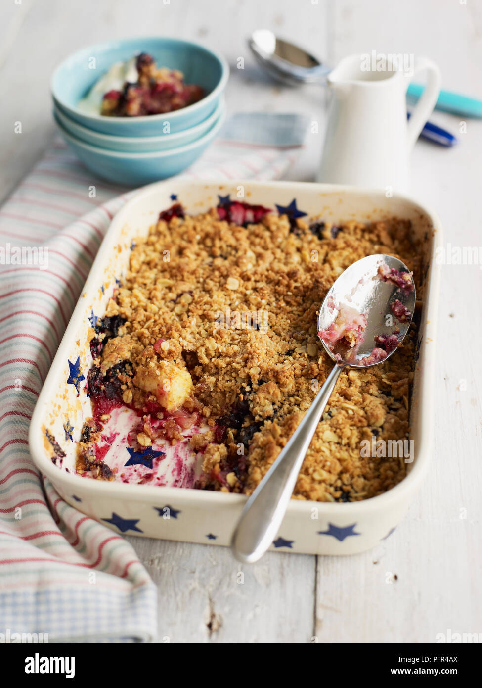 Apple and grape crumble bake in pie dish Stock Photo