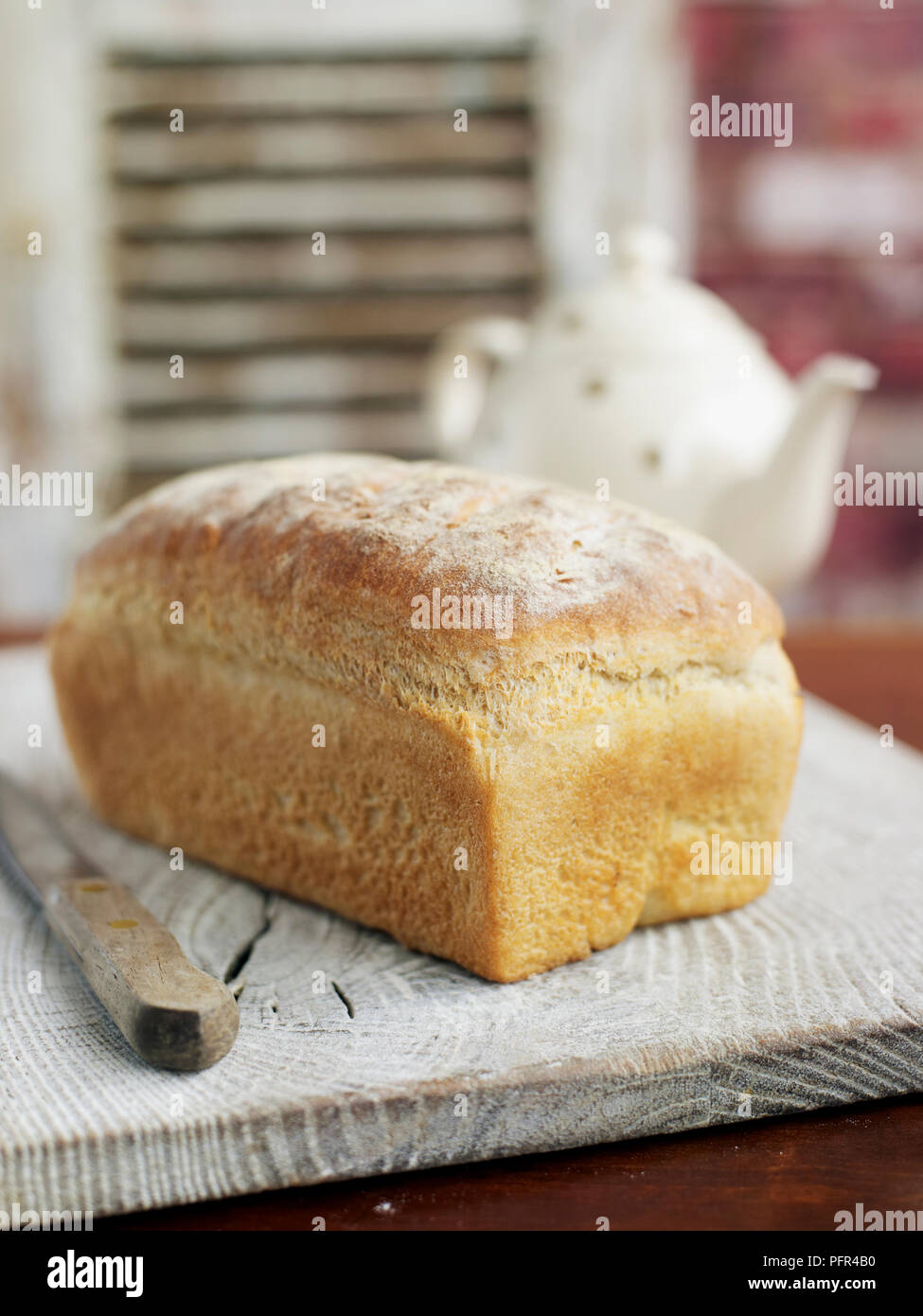 Loaf of bread on wooden board Stock Photo