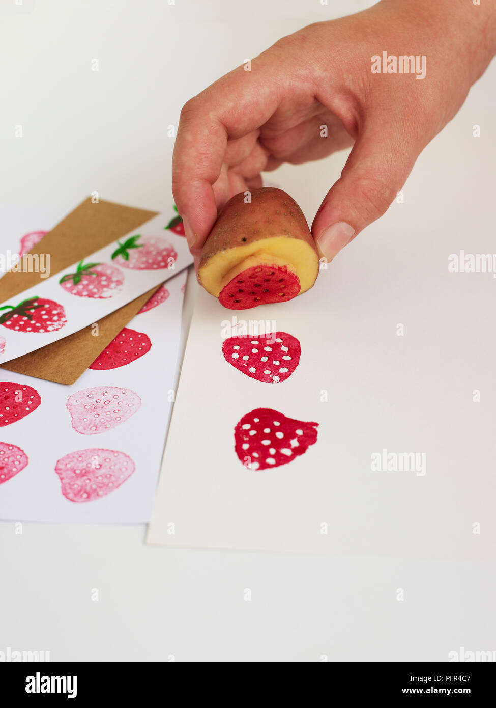 Making strawberry pattern (potato printing) Stock Photo