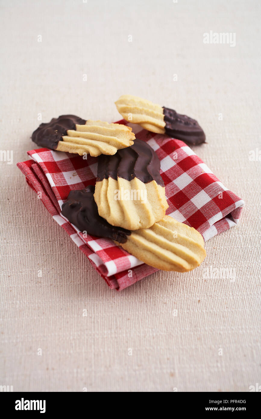 Chocolate-dipped Spritzgeback (Spritzgebaeck) biscuits Stock Photo
