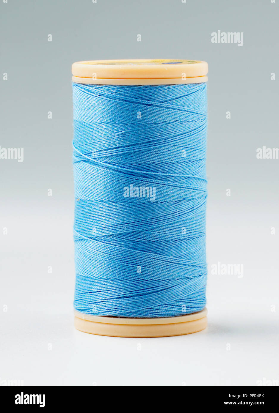 Reel of blue cotton sewing thread Stock Photo