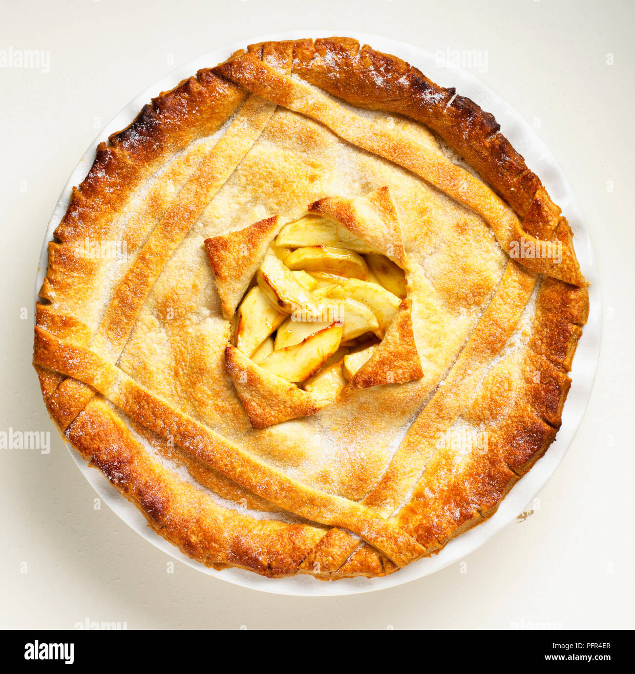 Apple pie with hole in the middle of the crust showing the filling Stock Photo