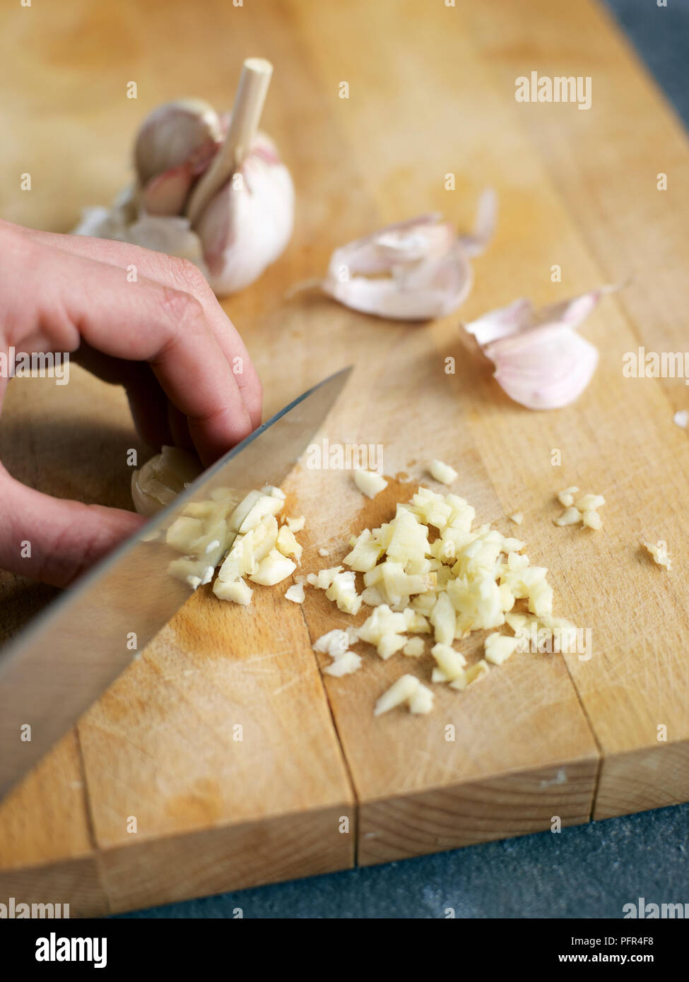 Chopping garlic Stock Photo