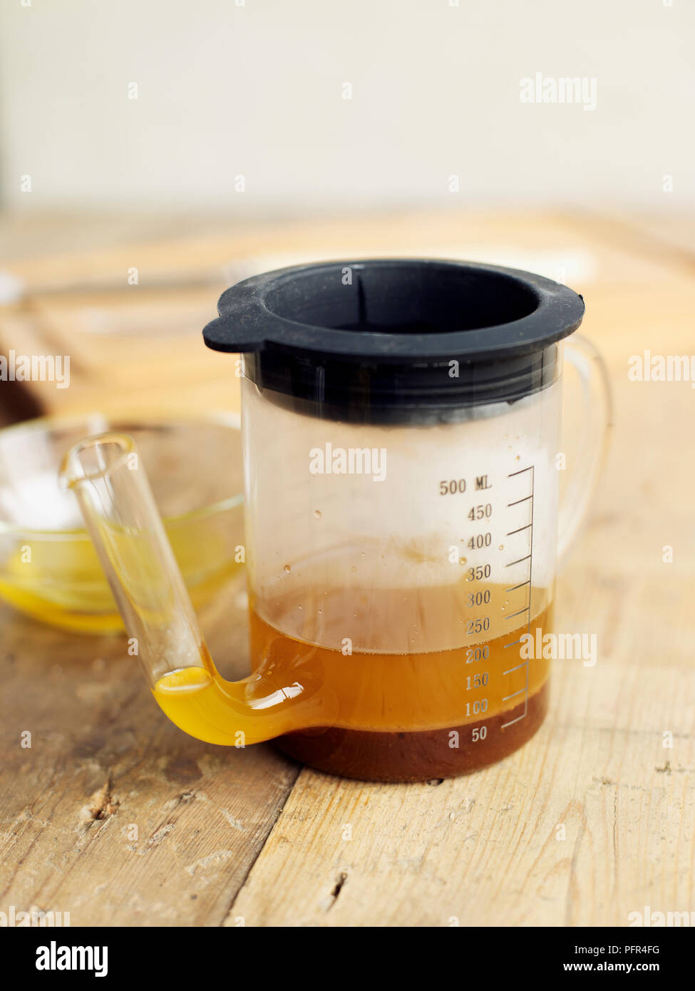 Gravy fat separator and measuring jug Stock Photo