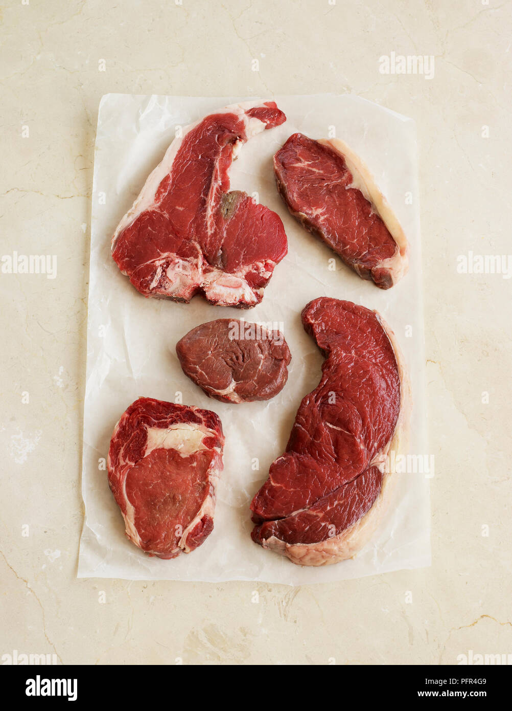 Selection of raw steaks, t-bone, sirloin, fillet, ribeye, and rump Stock Photo