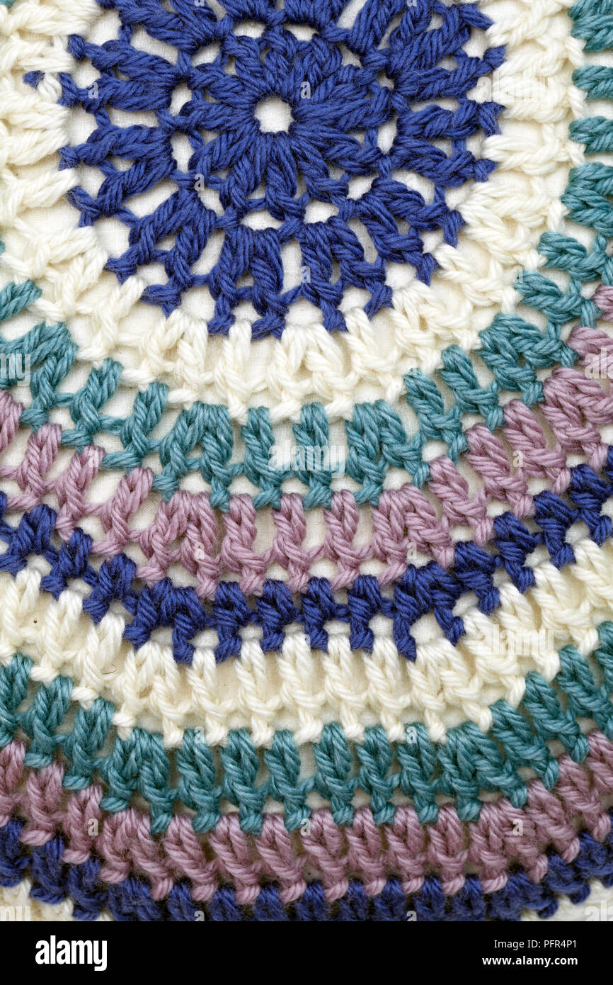 Colourful crocheted cushion, treble crochet stitch, close-up Stock Photo