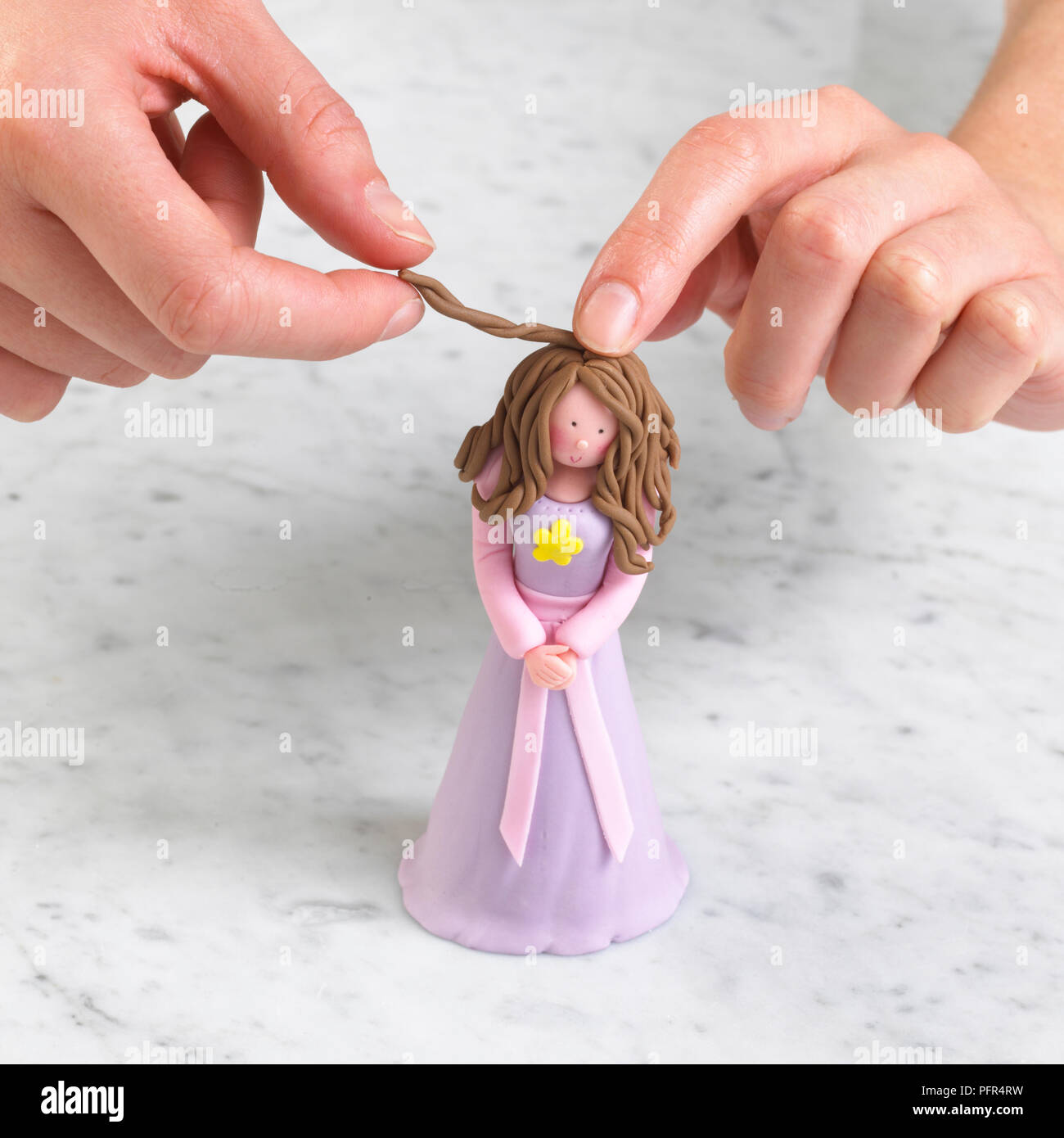 Lady being made from fondant icing Stock Photo