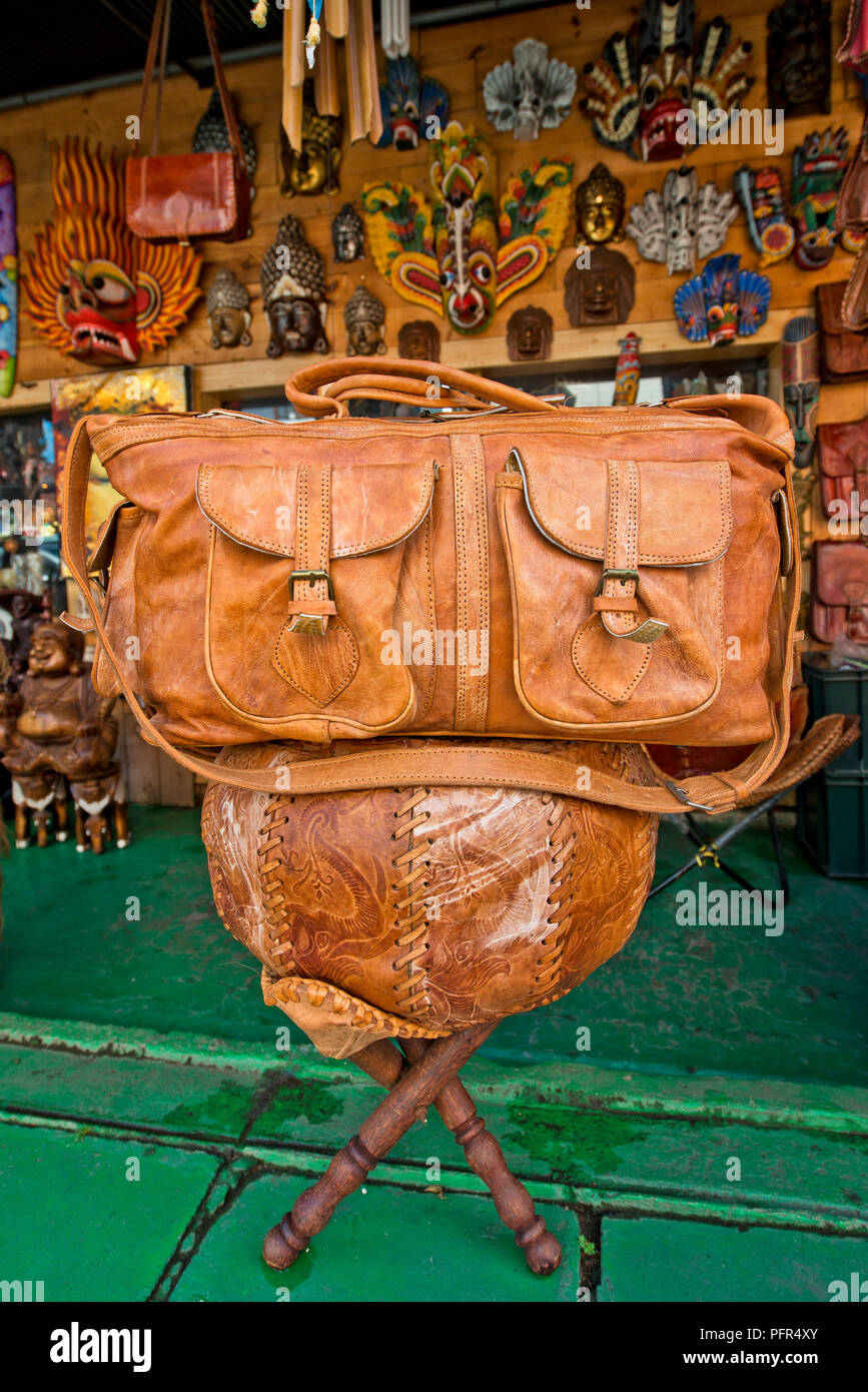 Sri Lanka, leather bag on stool at stall Stock Photo
