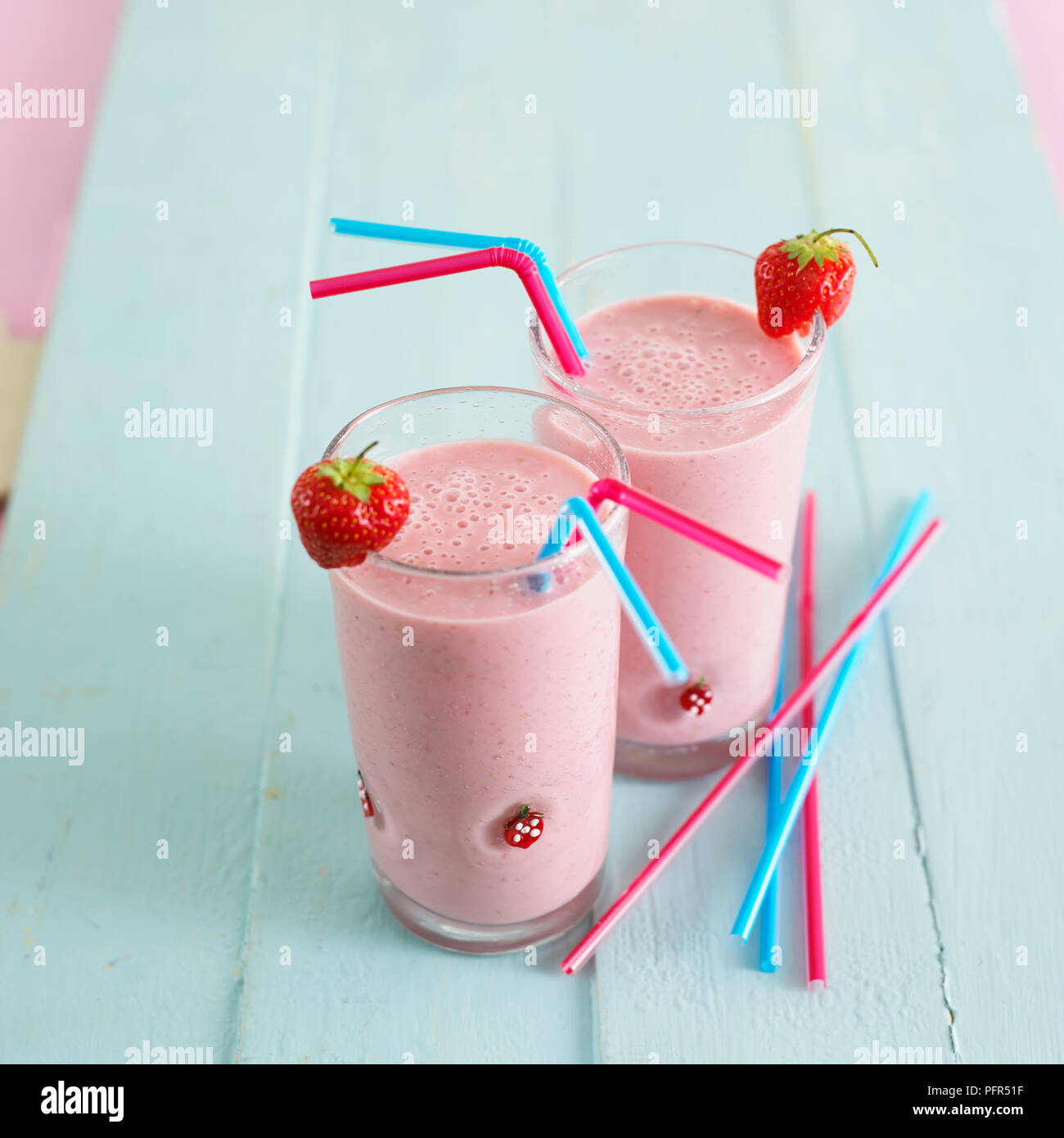 Two glasses of strawberry smoothie Stock Photo
