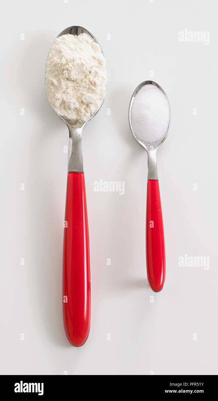 Tablespoon of flour and teaspoon of sugar Stock Photo