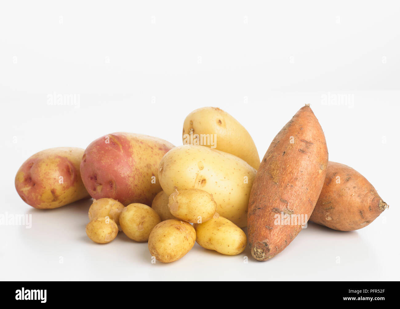 Selection of potatoes and sweet potatoes Stock Photo