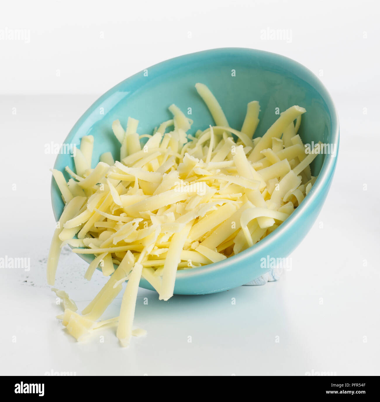 Bowl of grated cheese Stock Photo