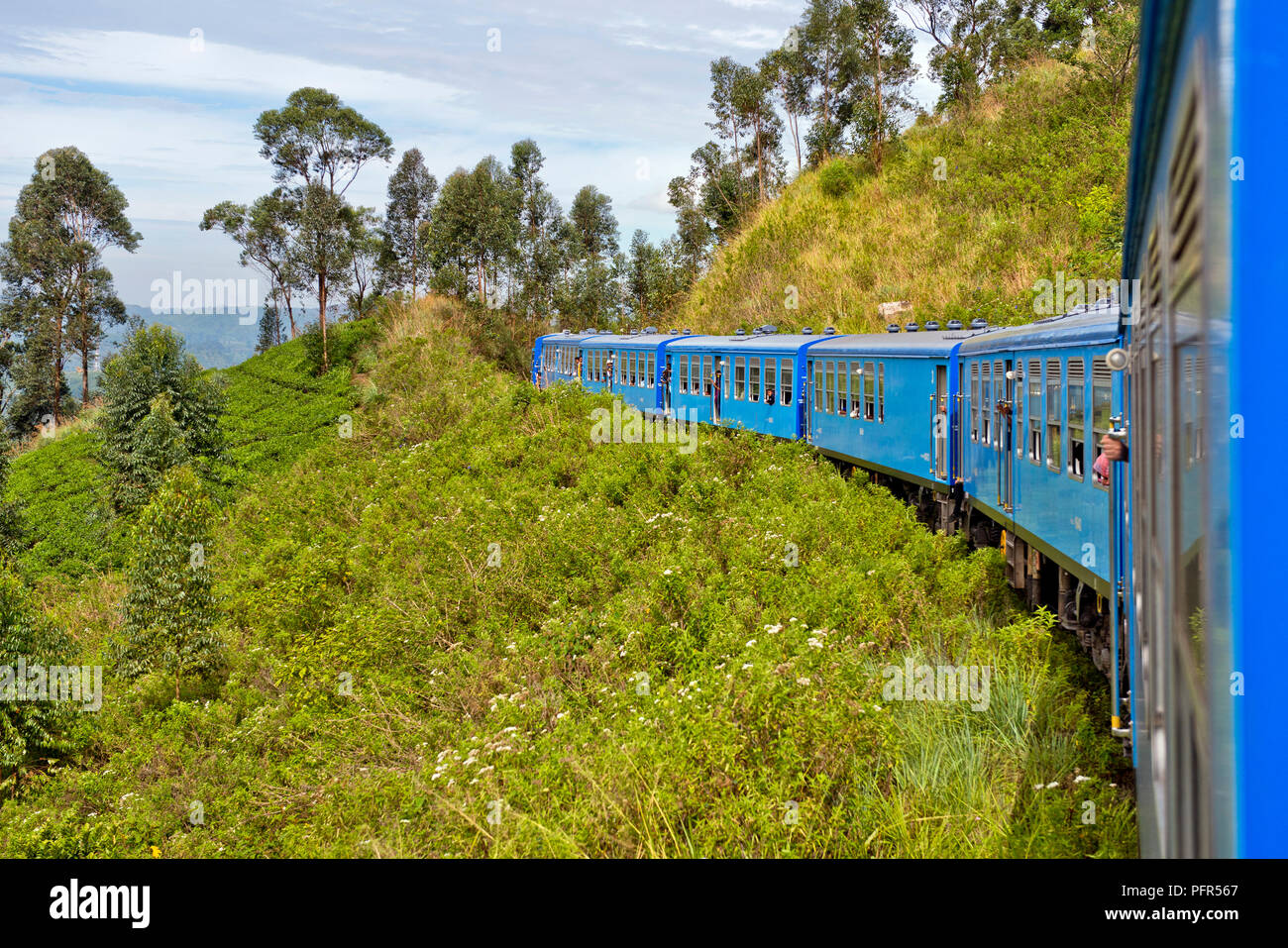 Sri Lanka, Central Province, Nuwara Eliya, train passing through mountains Stock Photo