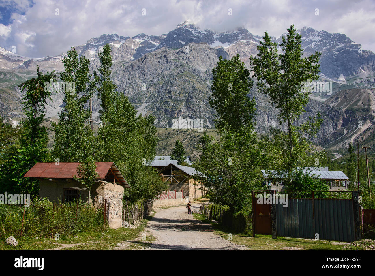 High alpine peaks behind the walnut village of Arslanbob, Kyrgyzstan Stock Photo
