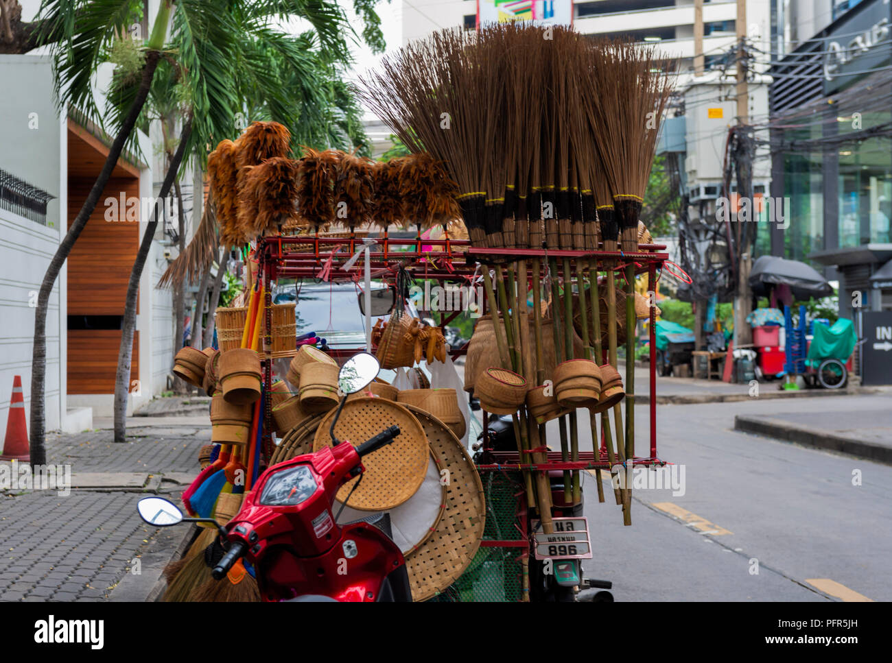 Street cart selling assorted brushes and brooms and other merchandise