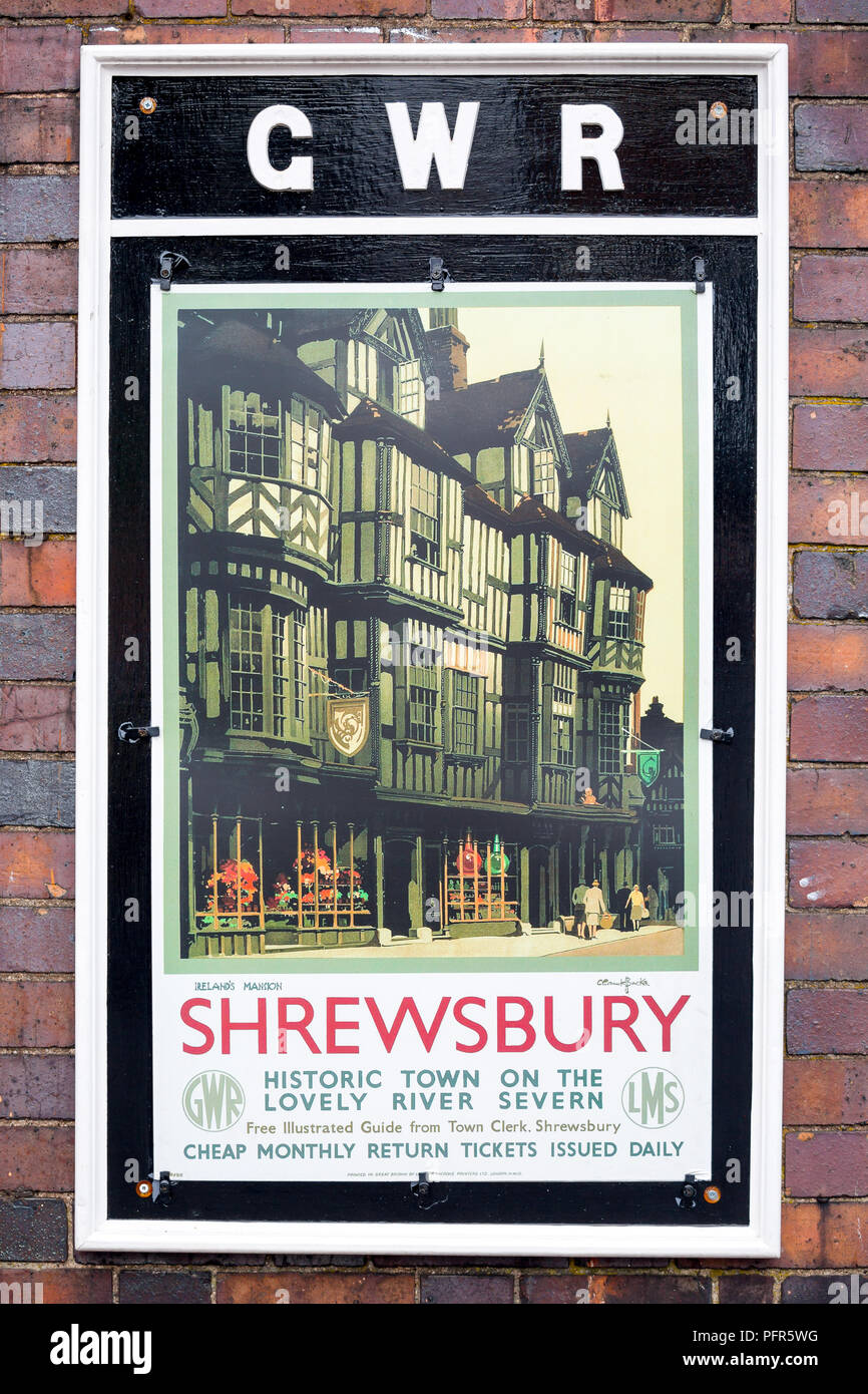 Vintage travel, GWR railway poster outdoors at train station on heritage railway line, UK, advertising historic Shrewsbury town. Stock Photo