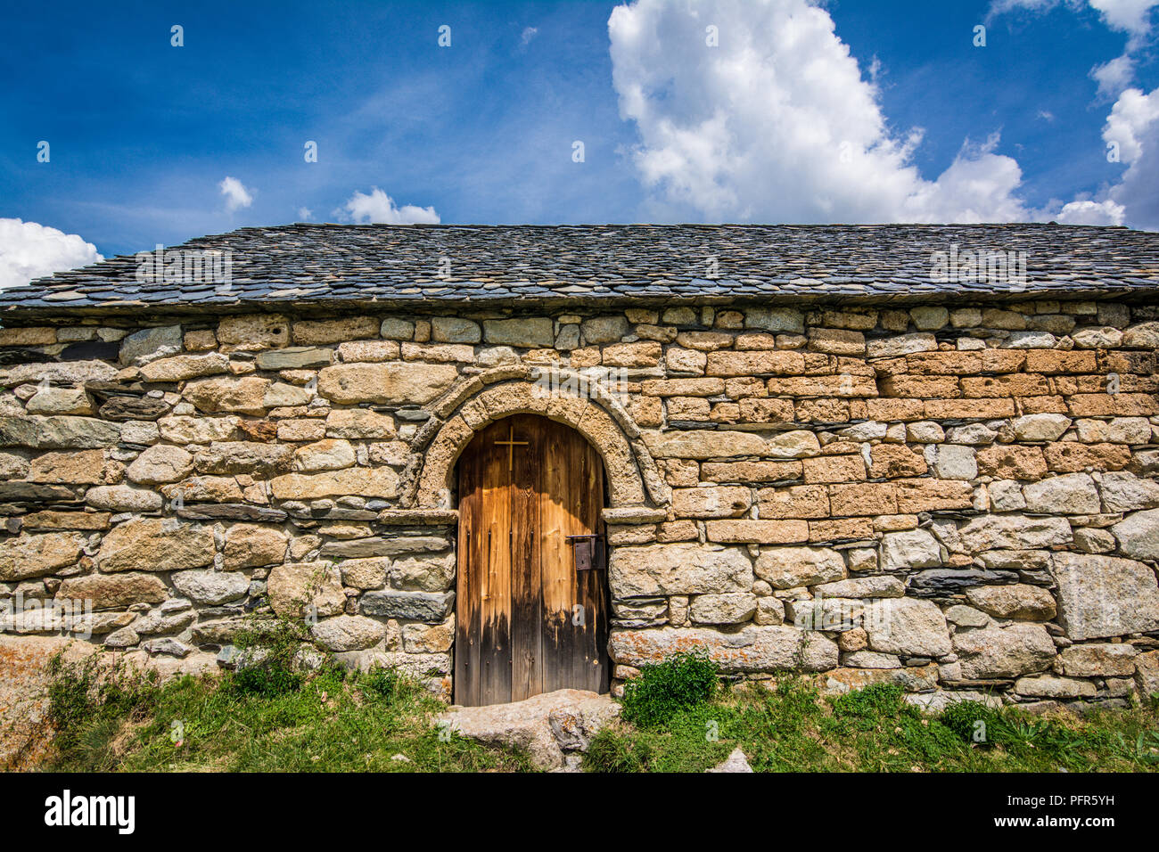 Old Romanesque wooden door of the Sant Quirc de Taull , Catalonia, Spain. Catalan Romanesque Churches of the Vall de Boi are declared a UNESCO World H Stock Photo