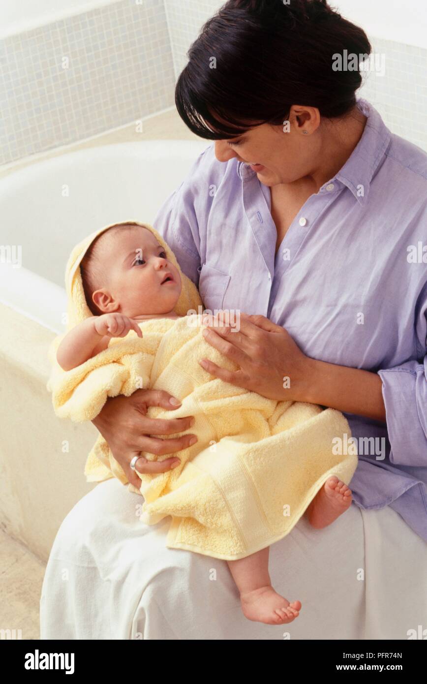 baby holding towel