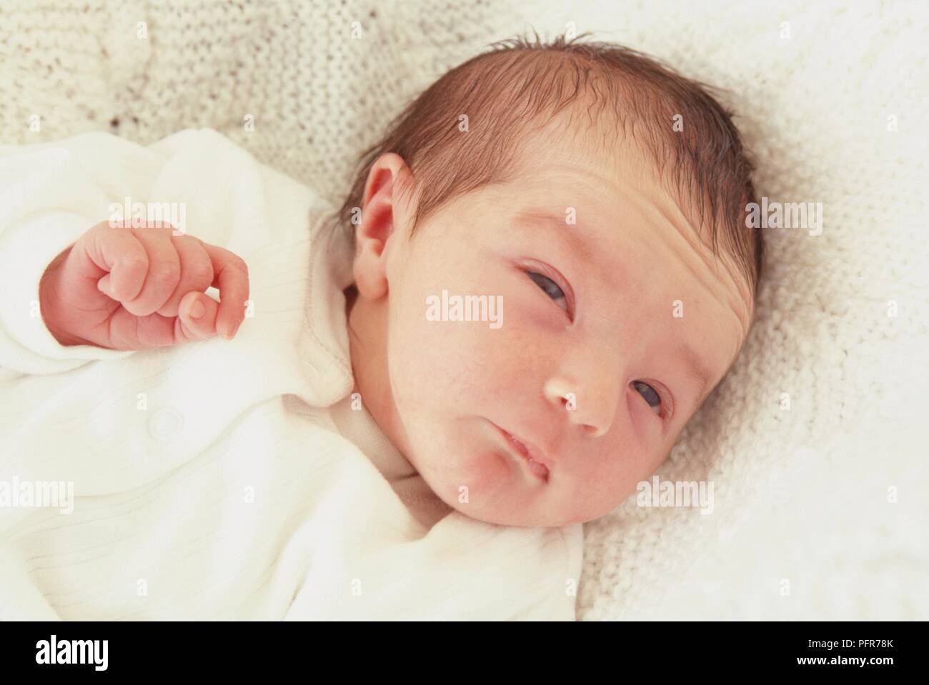 Newborn baby lying on blanket, close-up Stock Photo